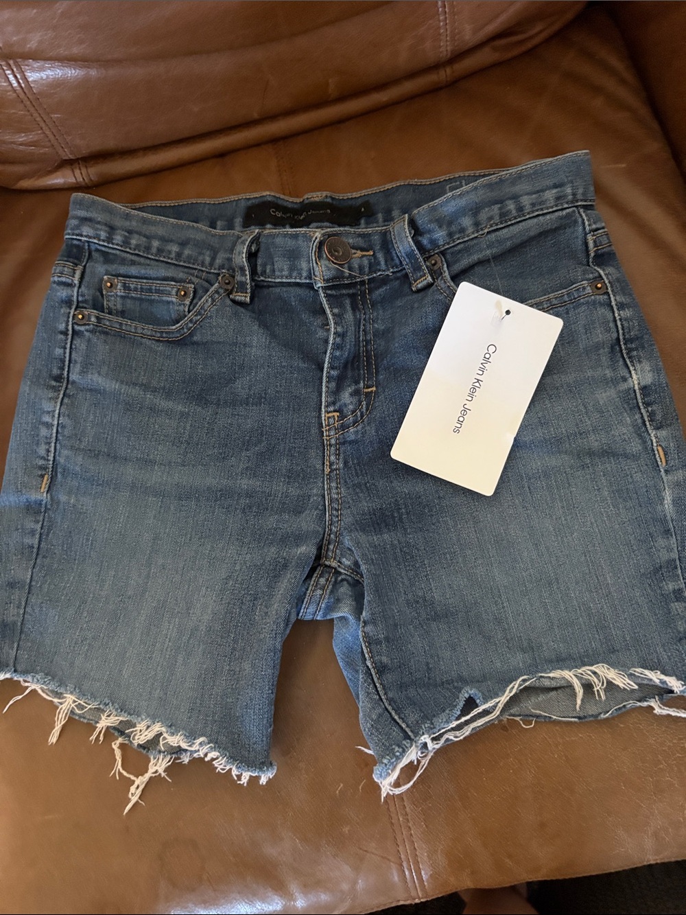 Calvin Klein Jeans Light Blue Denim Shorts with Frayed Hem